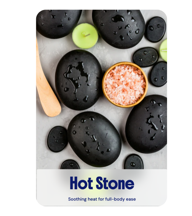 A soothing Hot Stone massage set with smooth black stones and pink salt, providing deep heat for full-body ease at River Oaks Thai Massage in Houston.